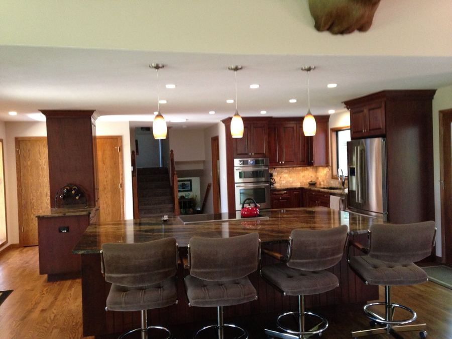 Cherry kitchen with long cooktop island