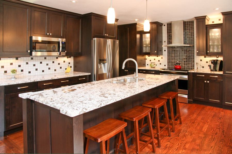 Espresso cabinets with light stone island
