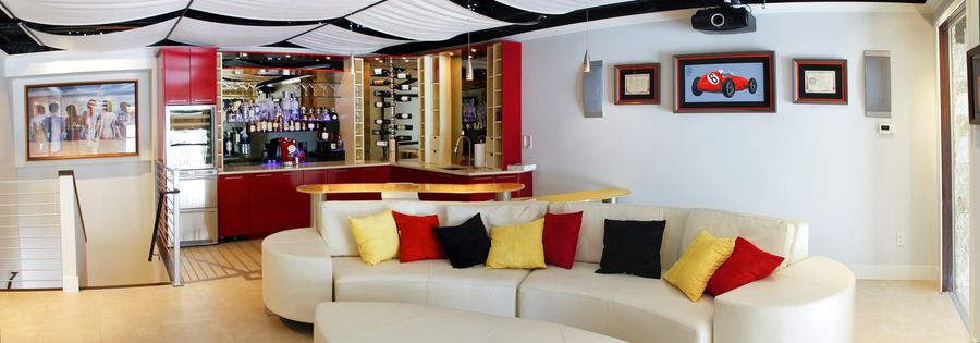 Basement lounge with glossy red wet bar
