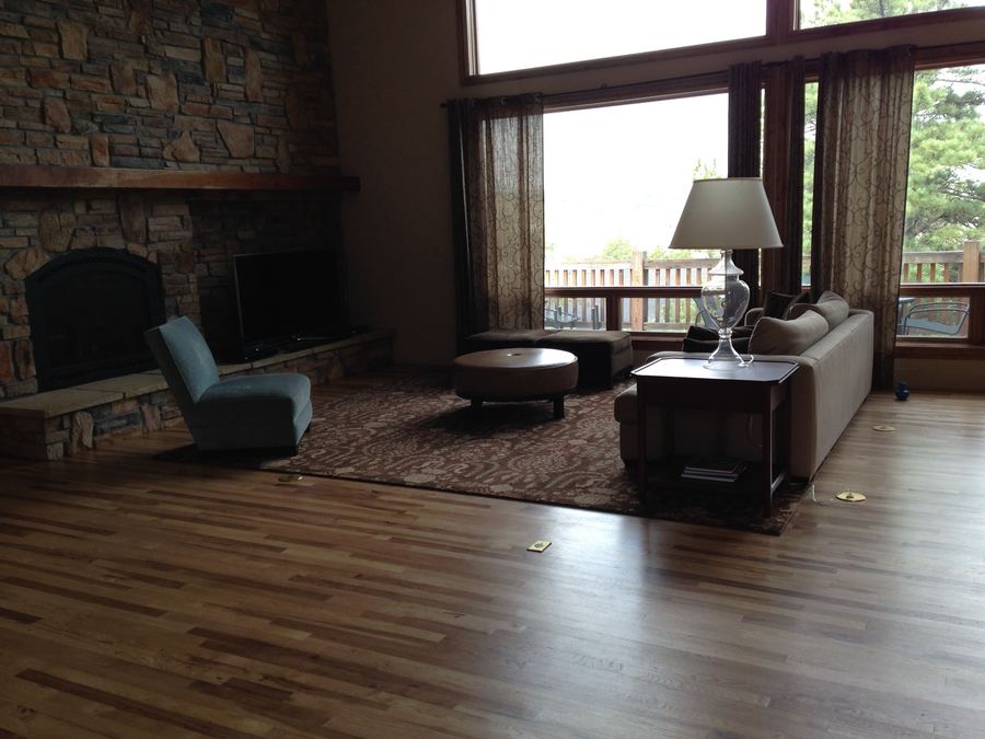 Two-story living room with stone fireplace